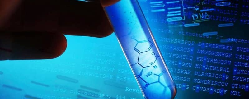 Hand holding a test tube